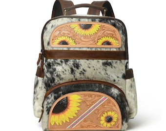May include: A brown leather backpack with a white and black cowhide pattern. The backpack has a large front pocket with a tooled leather design featuring three yellow sunflowers. The backpack also has a smaller front pocket with a tooled leather design featuring two yellow sunflowers.