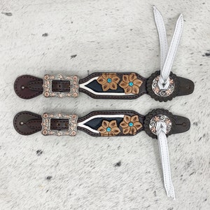 Spurs Leather Ladies Spur strap decorated with Engraved flowers with turquoise stone and white leather fringe at corner concho