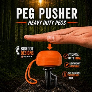 May include: An orange plastic peg pusher tool with an attached orange loop, positioned over a black metal tent peg. Text reads PEG PUSHER, HEAVY DUTY PEGS, BIGFOOT DESIGNS, FITS PEGS UP TO 14MM, LIGHTWEIGHT & PORTABLE, HEAT RESISTANCE EXCEEDS 60C >140F.