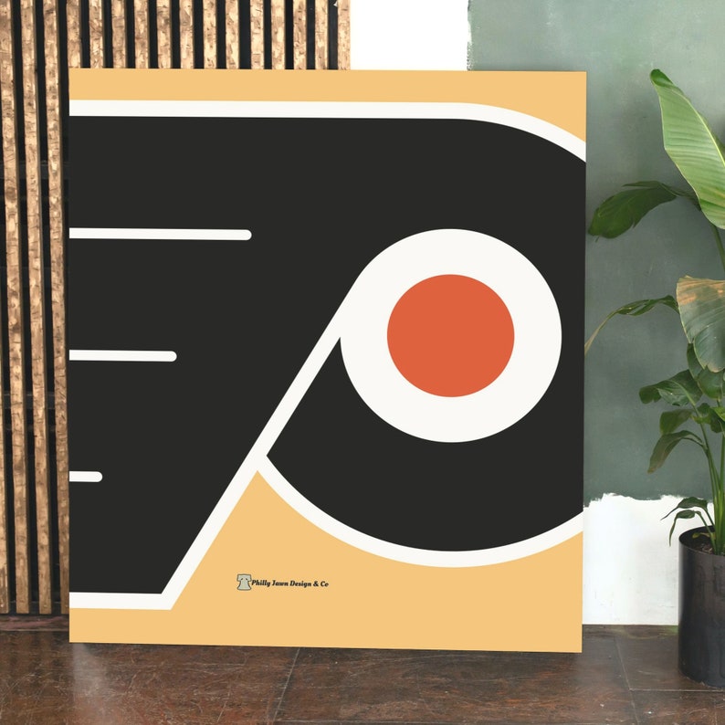 May include: A black and white graphic of the Philadelphia Flyers logo on a beige background. The logo features a large black 'P' with a white outline and a red circle inside. The text 'Philly Jawn Design & Co' is in the bottom right corner.