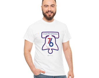 May include: White t-shirt with a blue and red graphic of the Liberty Bell with the number 76 inside. The text "trust the process" is above the graphic.