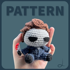 May include: Crocheted doll of a character from a horror movie, with a gray head, brown hair, and a blue jumpsuit. The doll is holding a small, red-stained knife. The word "PATTERN" is displayed in large, gray letters above the doll.