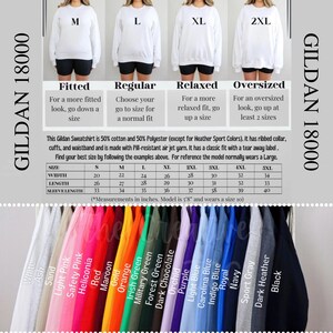 May include: White Gildan 18000 sweatshirt with size options: Fitted, Regular, Relaxed, and Oversized. Includes a size chart with measurements in inches for sizes S-5XL. Available in various colors like black, navy, and red.
