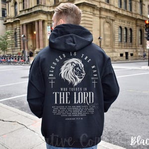 May include: Black hoodie with a white graphic print of a lion and the text "Blessed is the man who trusts in the Lord". The text includes a bible verse from Jeremiah 17:7-8.