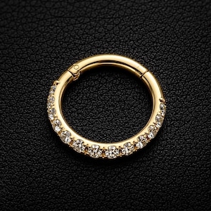 Anillo de clic con segmento joya de circonita cúbica continua con bisagras en oro de 9 k.