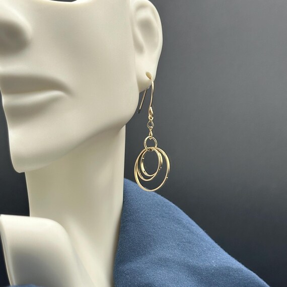 Gold Infinity Dangle Earrings - image 7