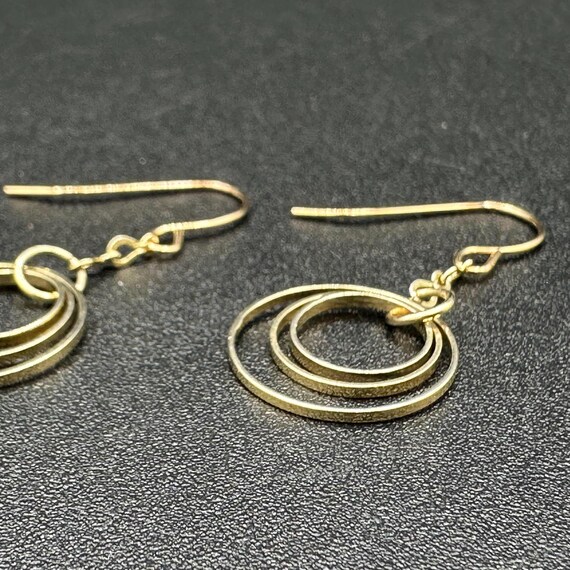 Gold Infinity Dangle Earrings - image 8