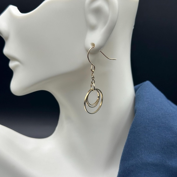Gold Infinity Dangle Earrings - image 4