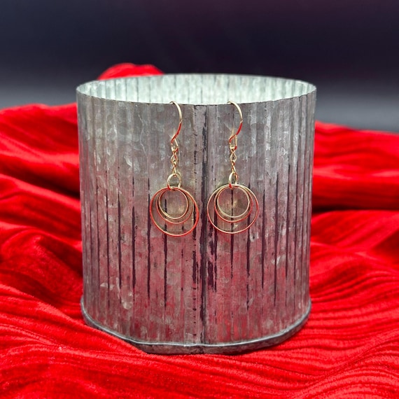 Gold Infinity Dangle Earrings - image 1