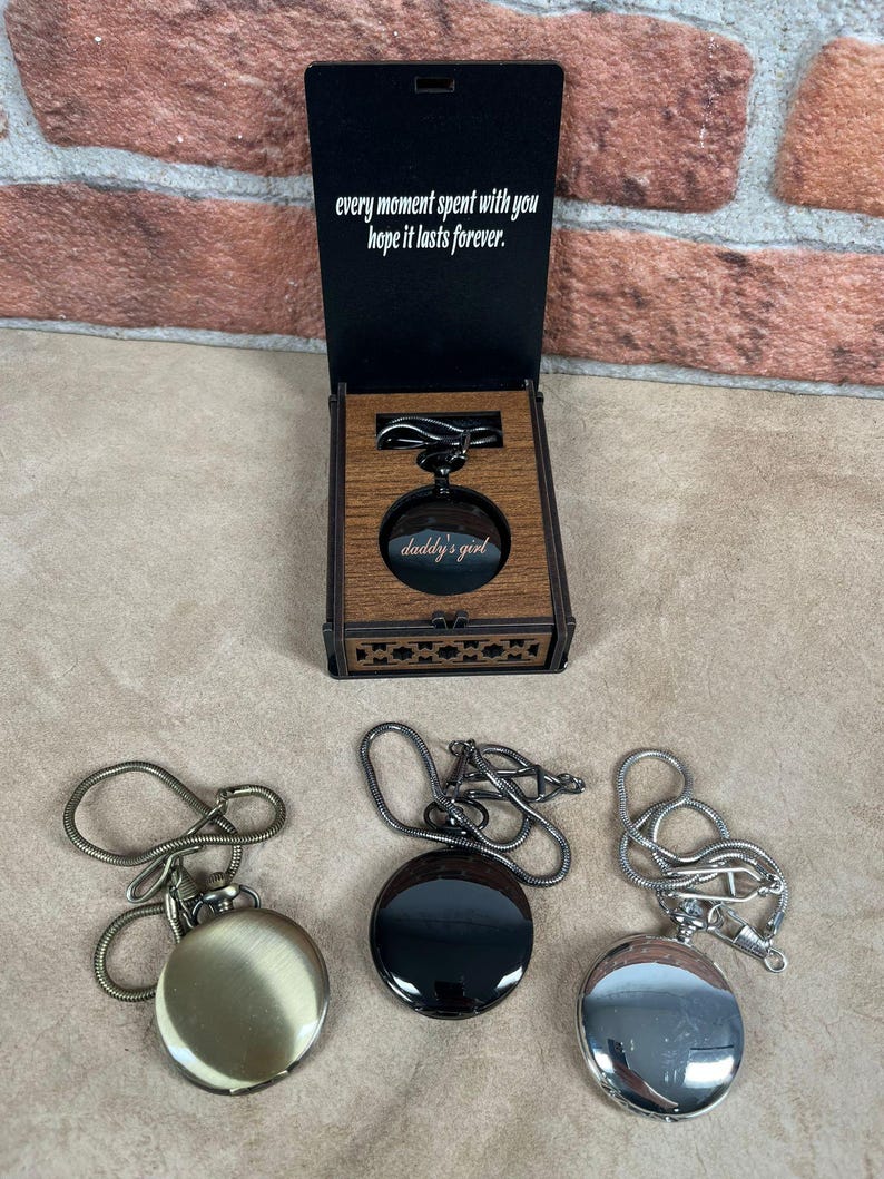 May include: A wooden box with a pocket watch inside, and two other pocket watches. The box has the text "every moment spent with you hope it lasts forever." The pocket watch inside the box has the text "daddy's girl."