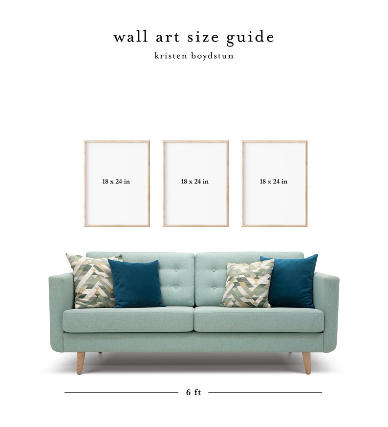 May include: Three 18 x 24 inch wood framed prints hanging above a light blue sofa with patterned throw pillows. The sofa is 6 feet wide.