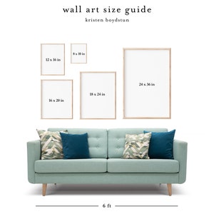May include: A wall art size guide with a light blue sofa and four different sized frames. The frames are 8x10 inches, 12x16 inches, 16x20 inches, and 24x36 inches. The sofa is 6 feet long.