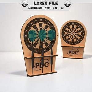 May include: Two wooden dartboard sets. The larger set has three darts and a shelf. The dartboards have black and white target designs with numbers. The text "LASER FILE" and "LIGHTBURN - SVG - DXF - AI" are at the top.