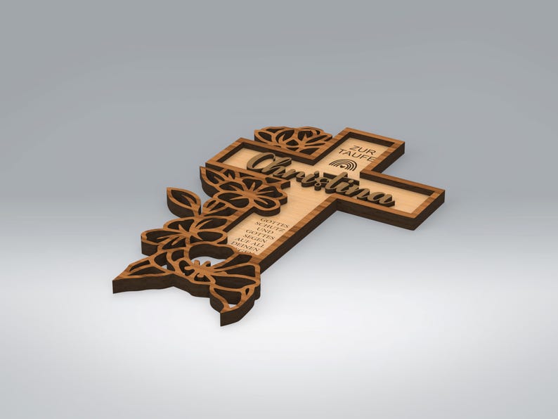 May include: Wooden cross with floral cutouts and the name "Christina" in script. The cross has a light wood center and a darker wood frame. Text on the cross reads "ZUR TAUFE" and other text in German.