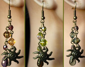 Pendientes de bronce antiguo con sol en espiral y cristal checo, verde, azul y morado