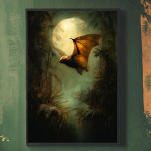 May include: A framed art print featuring a bat in flight against a moonlit backdrop. The bat has brown wings and a dark body, set against a dark, atmospheric forest scene. The artwork is framed in black.