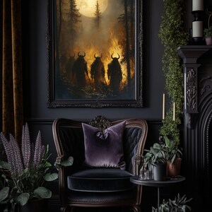 May include: A dark living room with a black velvet armchair, a side table with potted plants, and a framed painting of three figures in a forest with a full moon. The painting has a dark, moody aesthetic.