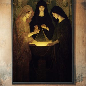 May include: A framed print of a painting depicting three figures in dark robes gathered around a glowing, golden bowl. The figures appear to be women, with two wearing black hoods. The artwork has a vintage, gothic aesthetic.