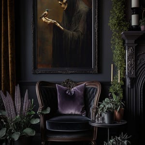 May include: A dark, moody living room with a framed painting of a skeletal figure in a hooded robe holding a small bird. The room features a black armchair with a purple pillow, a side table with potted plants, and a fireplace with candles.