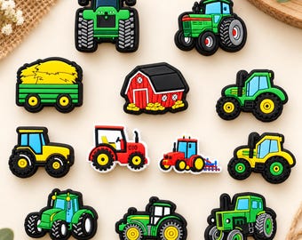 May include: A collection of twelve colorful rubber shoe charms featuring various farm-themed designs, including green, yellow, and red tractors, a green trailer filled with yellow hay, and a red barn with a black roof, all with black outlines.