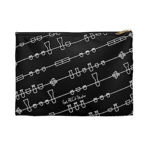 May include: Black zippered pouch with a white repeating pattern of musical notes and the text "Get REC'd Studio".