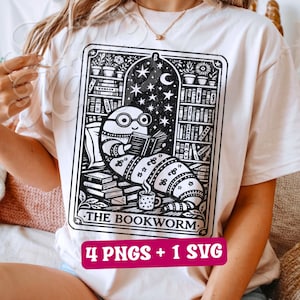 May include: Cream-colored t-shirt featuring a black and white graphic of a bookworm reading in a library setting. The design includes the text "THE BOOKWORM" and the text "4 PNGS + 1 SVG".
