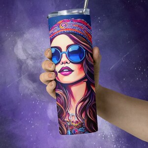 May include: A stainless steel tumbler with a colorful illustration of a woman wearing sunglasses and a headband. The woman has long brown hair and is wearing a colorful patterned shirt.