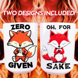 May include: Two white ceramic mugs with a fox design. The mug on the left says "Zero Given" and the mug on the right says "Oh, For Sake".