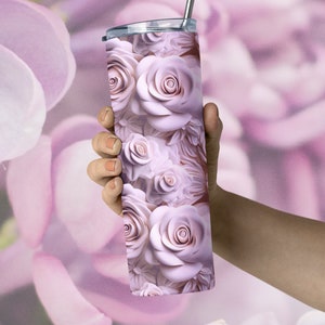 human hand holding a pretty floral tumbler with a  wrap digital design sublimation png.  a 3d design featuring pink roses in a carved effect.  roses floral 3d carved effect tumbler wrap