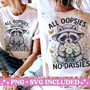 May include: White t-shirt with a black and white illustration of a raccoon wearing a hat and holding a bouquet of daisies. The text "All oopsies no daisies" is printed on the shirt.