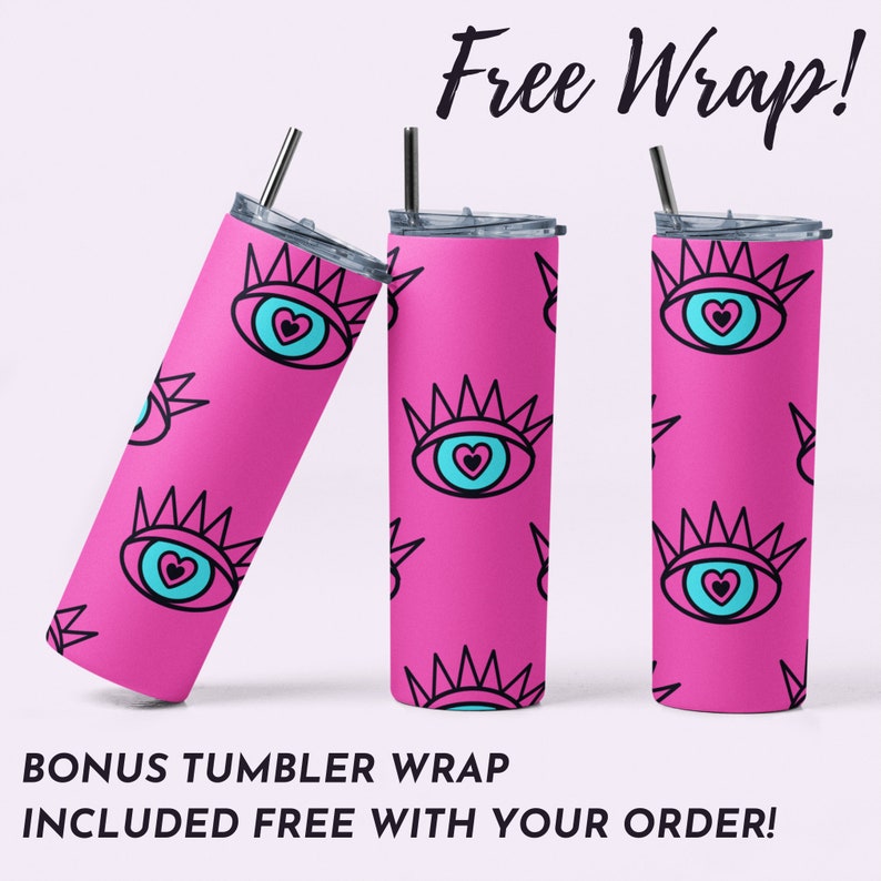 May include: Three pink stainless steel tumblers with a repeating pattern of a blue eye with a pink heart inside and a black crown. The tumblers are all in focus and the text "Free Wrap!" is at the top of the image. The text "BONUS TUMBLER WRAP INCLUDED FREE WITH YOUR ORDER!" is at the bottom of the image.