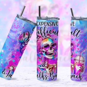 May include: A stainless steel tumbler with a colorful design featuring a skeleton with rainbow hair wearing sunglasses and holding a drink. The text "Expensive & Difficult" is printed on the tumbler.