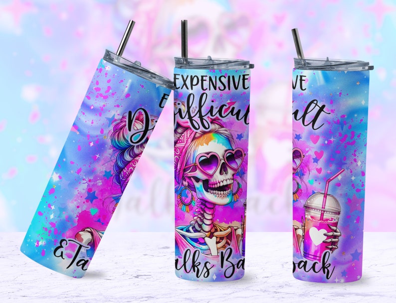 May include: A stainless steel tumbler with a colorful design featuring a skeleton with rainbow hair wearing sunglasses and holding a drink. The text "Expensive & Difficult" is printed on the tumbler.