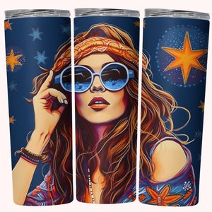 May include: A set of three stainless steel tumblers with a colorful illustration of a woman with long brown hair wearing blue sunglasses and a headband. The background is a dark blue with stars and a large yellow star.