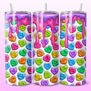 May include: Three stainless steel tumblers with a white background and a pink, purple, and blue dripping glaze. The tumblers are covered in colorful heart-shaped candies with messages like "It's Love", "First Kiss", "Love Her", and "Sweet Heart".