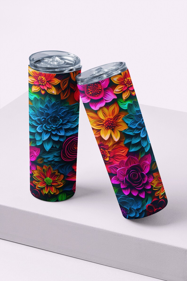 May include: Two stainless steel tumblers with colorful floral designs. The tumblers are decorated with a variety of flowers in shades of pink, blue, yellow, orange, and red. The flowers are arranged in a layered, 3D style, creating a unique and eye-catching design.