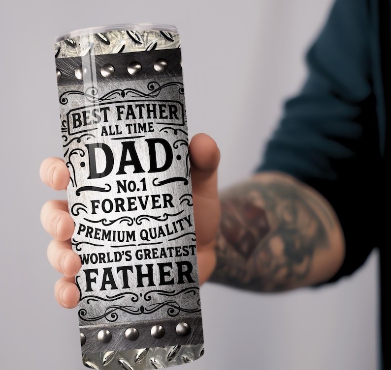 May include: A stainless steel tumbler with the words "BEST FATHER ALL TIME DAD No.1 FOREVER PREMIUM QUALITY WORLD'S GREATEST FATHER" printed in black and white. The tumbler has a diamond plate design and silver rivets.