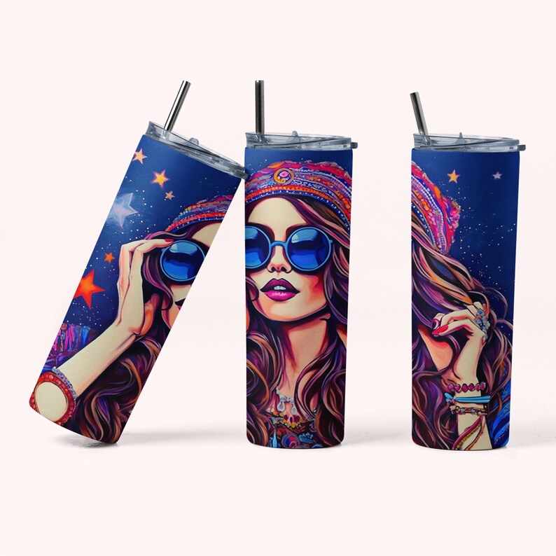 May include: A stainless steel tumbler with a colorful illustration of a woman wearing sunglasses and a patterned hat against a blue background with stars.