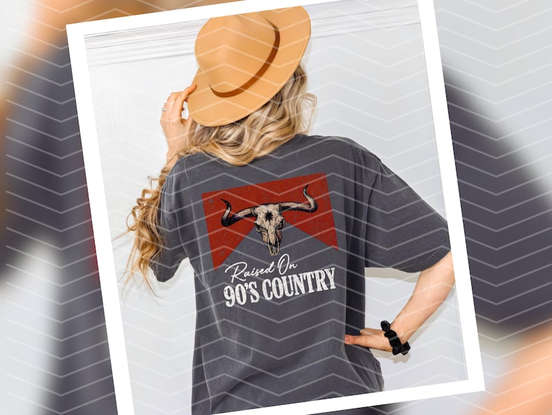 May include: A gray t-shirt with a red and white graphic of a bull skull and the text "Raised On 90's Country".