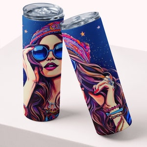 May include: Two stainless steel tumblers with a colorful illustration of a woman wearing a headband, sunglasses, and jewelry. The background is a dark blue with stars.