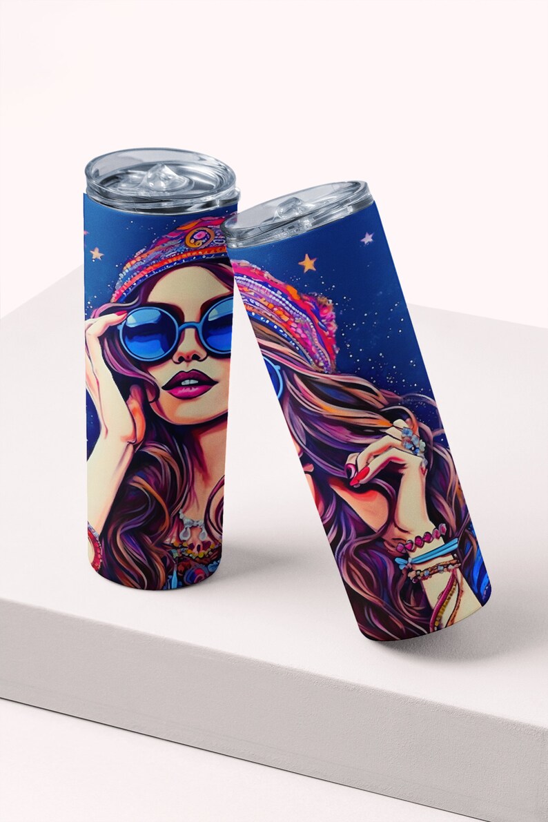 May include: Two stainless steel tumblers with a colorful illustration of a woman wearing a headband, sunglasses, and jewelry. The background is a dark blue with stars.