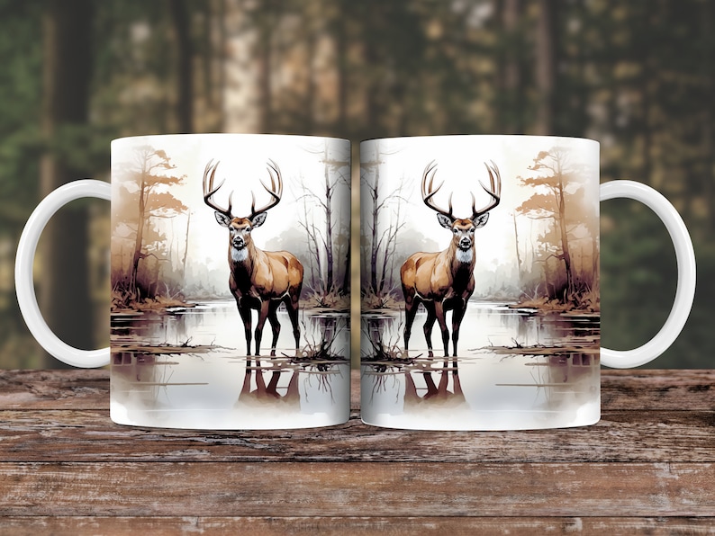 May include: Two white ceramic mugs with a deer standing in a lake in a forest scene. The deer is brown with large antlers. The mugs are 11 ounces.
