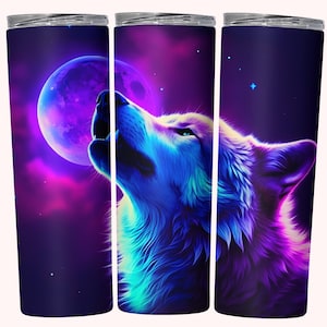 May include: A stainless steel tumbler with a colorful design of a wolf howling at the moon in a galaxy setting. The wolf is blue, purple, and green, and the moon is purple. The background is a dark blue with stars.