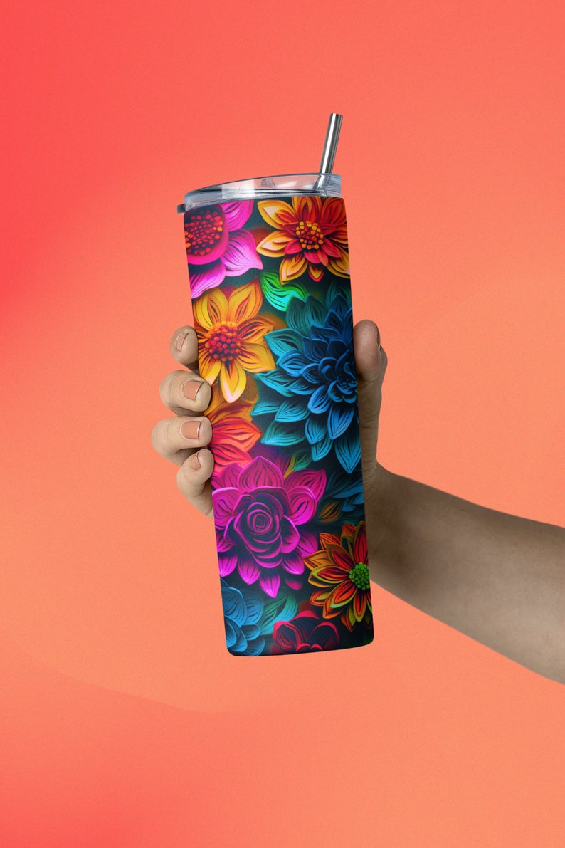 May include: A stainless steel tumbler with a colorful floral design. The flowers are in shades of pink, blue, yellow, orange, and green. The tumbler has a straw.