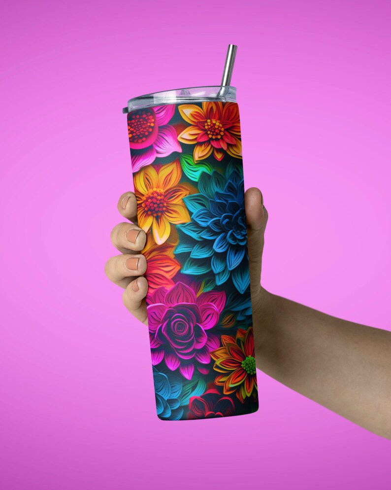 May include: A stainless steel tumbler with a colorful floral design. The tumbler has a lid and a straw. The flowers are in shades of pink, blue, yellow, orange, and green.