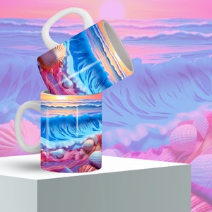 May include: Two white ceramic mugs with a colorful ocean wave and seashell design. The mugs are stacked on top of each other against a pink and blue background.