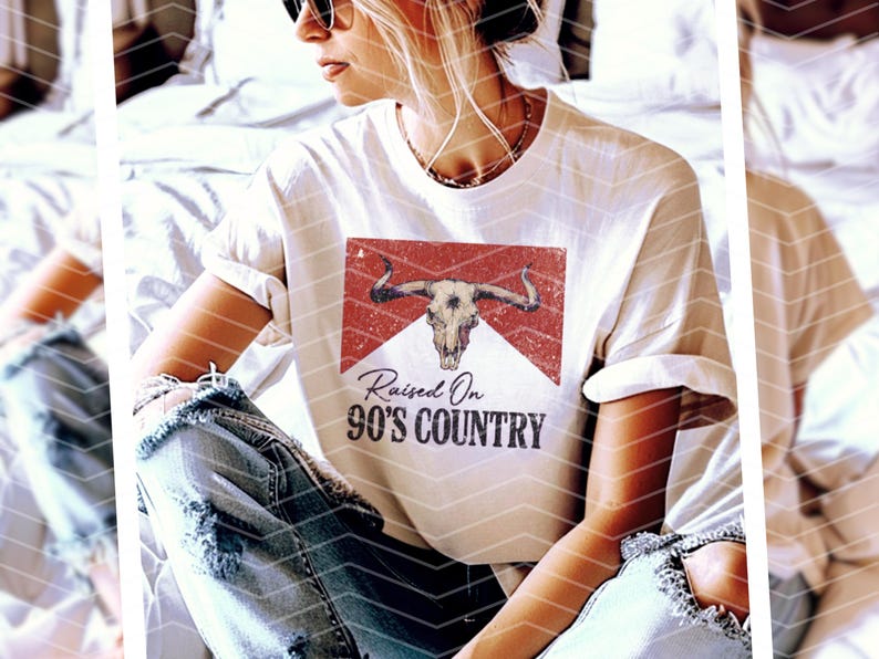 May include: White t-shirt with a red and white graphic of a bull skull and the text "Raised On 90's Country".