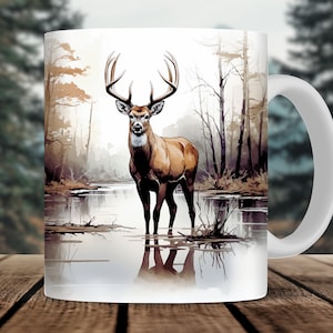 May include: White ceramic mug with a brown deer standing in a lake with a forest background. The deer has large antlers and is looking directly at the viewer.