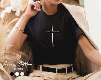 May include: Black t-shirt with a white cross and the text "Viva Cristo Rey" printed on the front.
