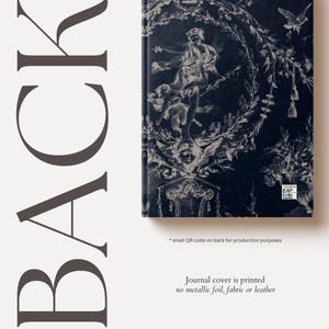 May include: A dark blue journal cover with a white and grey floral design. The cover features a cherub with wings and a small QR code on the back.